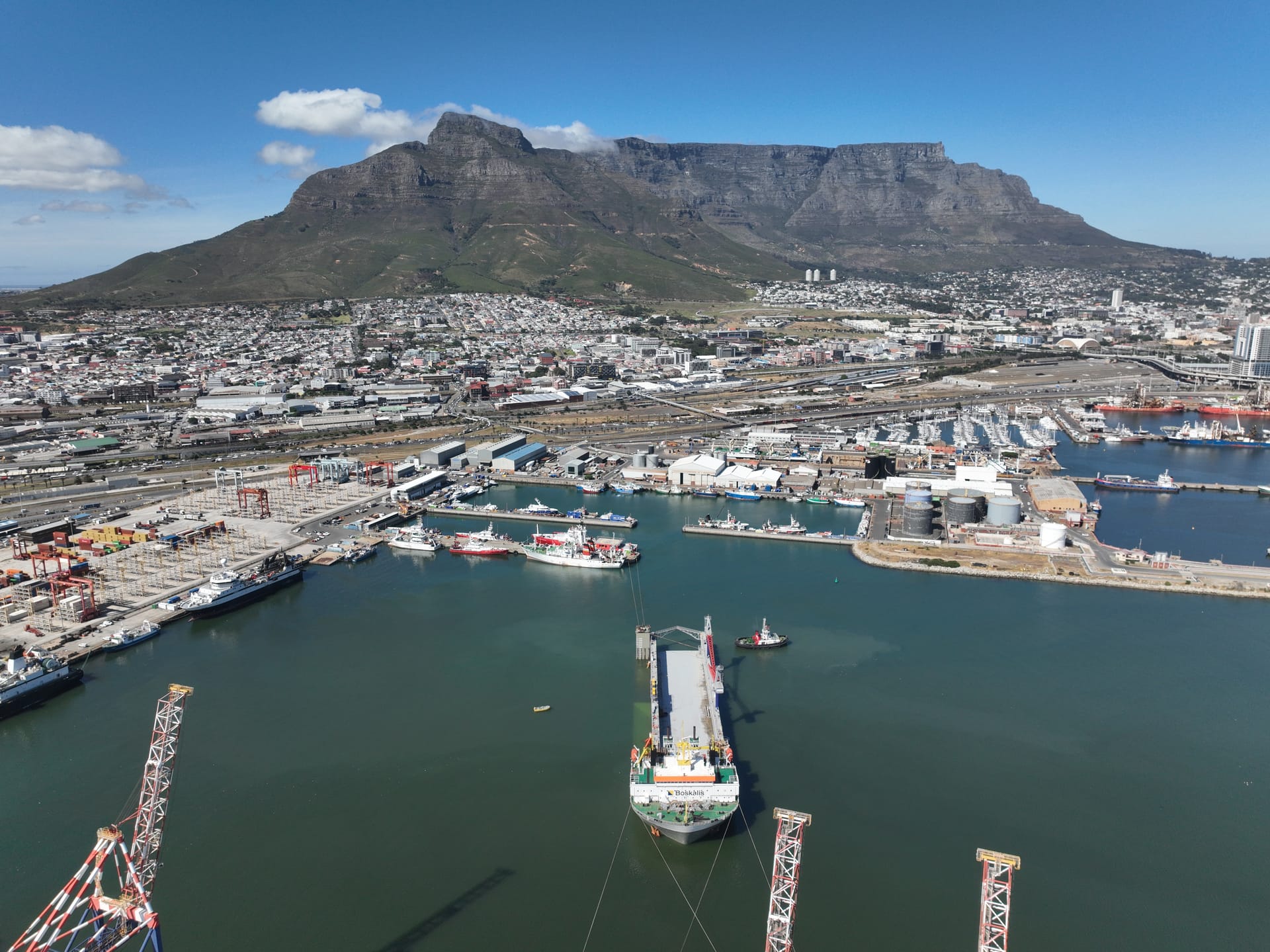 Aerial view of the Port of Cape Town, South Africa with Table Mountain behind: the repair, project-cargo and offshore-support harbour where Afrishore acts as vessel and rig agent